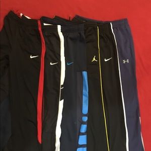 6 pair boys size L Nike, Jordan, and UA pants.